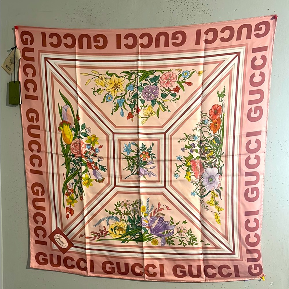 NWT Gucci Floral Pink Silk Scarf. GUCCI is written on 4 sides